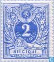 Lion couchant with coat of arms