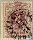 Lion couchant with coat of arms