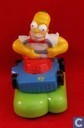 Homer Simpson op grasmaaier