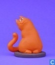 the red cat sitting