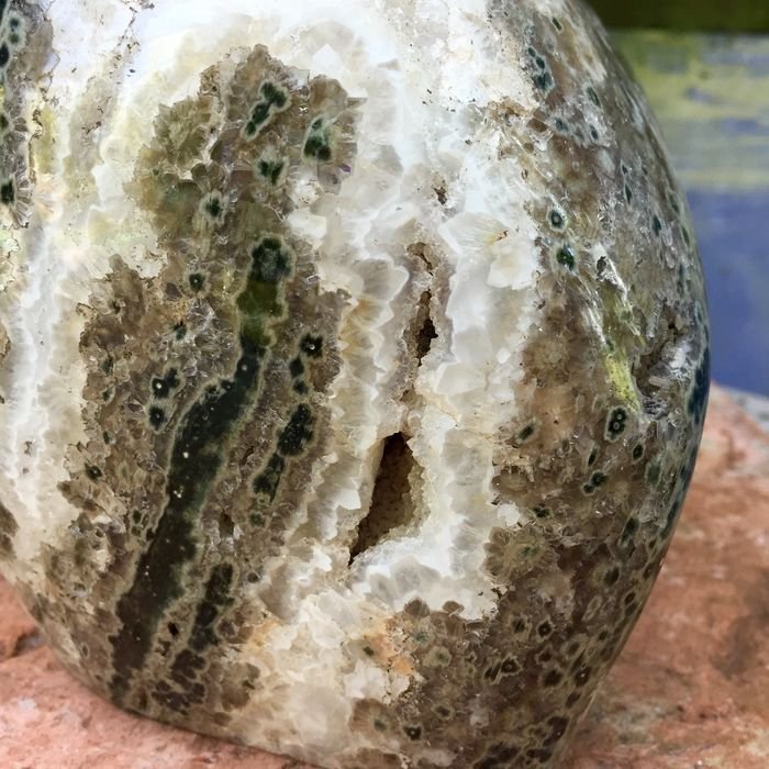Polished piece of ocean jasper with rough quartz 17 x 14