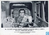 Scott guides remote control elevator cars 2, 3 and 4 by v.h.f.monitors on car 1.