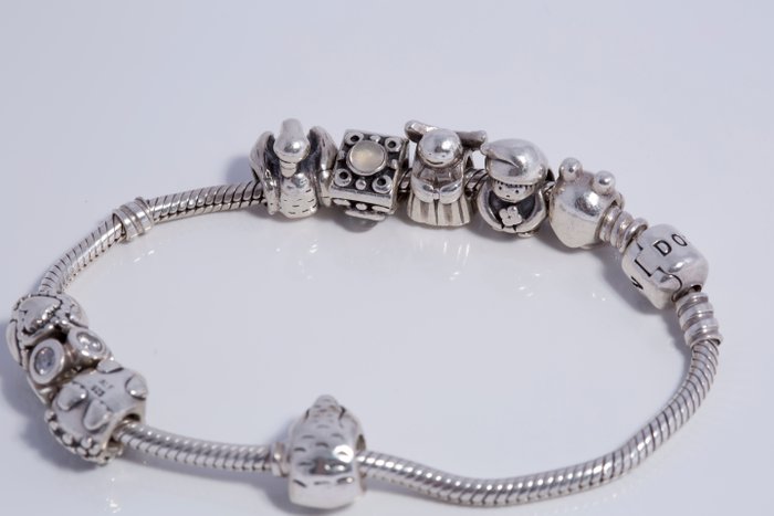 Braccialetto Pandora in argento con 8 ciondoli originali - Catawiki
