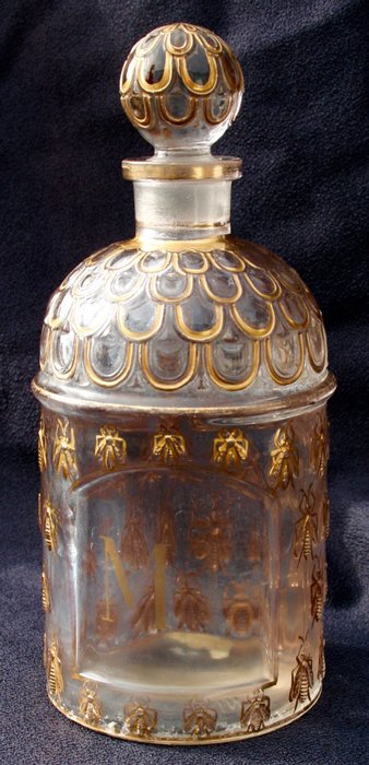 Guerlain goldplated bottle with bees