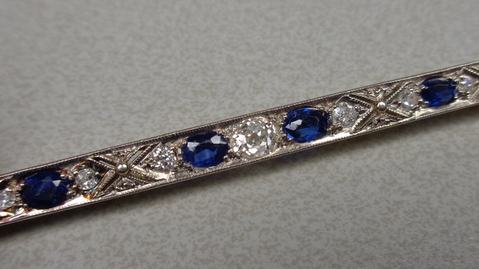 Antique, gold and platinum bar brooch with sapphires and diamonds