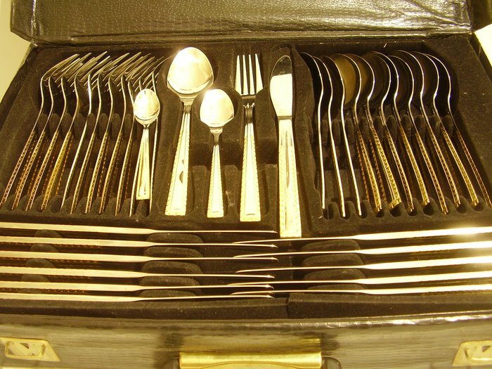 H. K. p. 18/10 stainless steel cutlery 84 pieces for 12 persons partly gold-plated in the cutlery case