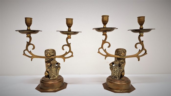Two copper candlesticks with the coat of arms of Amsterdam-1st half 20th century