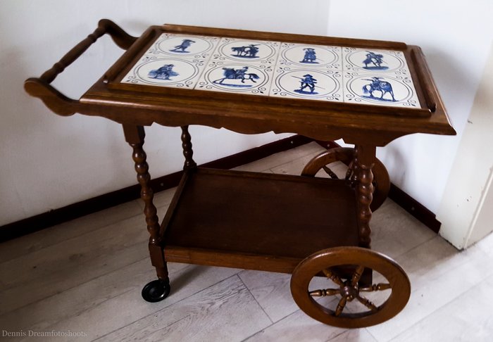 Antique wooden drinks trolley with old tiles