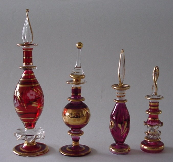 13 Egyptian perfume bottles with gold decoration