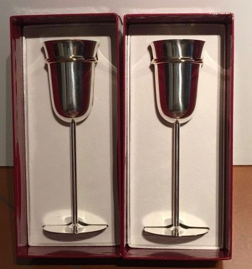 A pair of Must de Cartier sterling silver champagne flutes, France, late 20th century