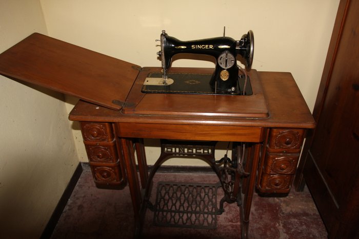 Singer sewing machine with a piece of furniture

