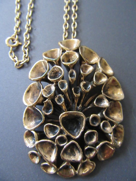 Hannu Ikonen designer pendant on necklace

