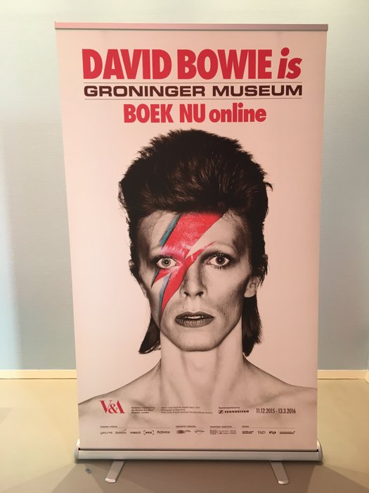 Exhibition banner for 'David Bowie is' with image of Alladin Sane 