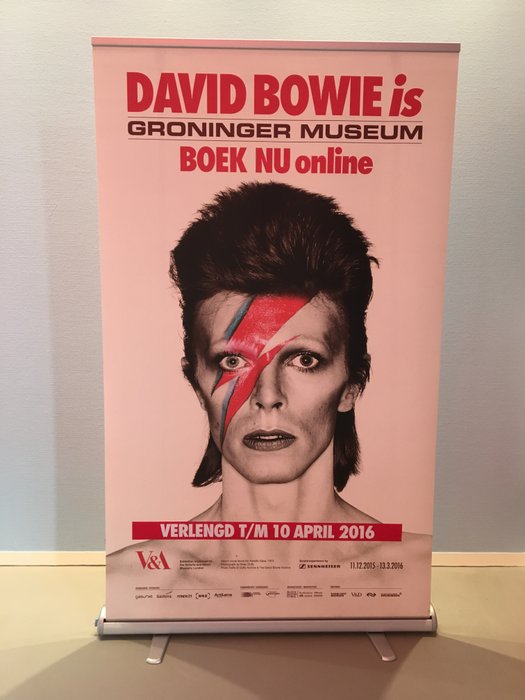 Exhibition banner for 'David Bowie is' with image of Alladin Sane and extended exhibition tekst