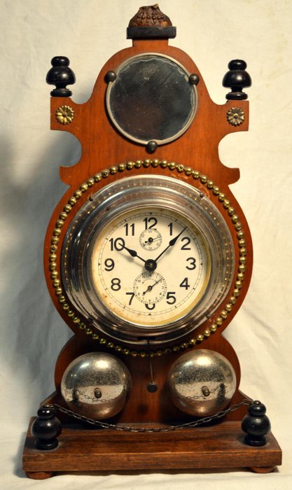 Antique table alarm clock made entirely of wood. Alarm with double bell. End of the 1800s or early 1900s.