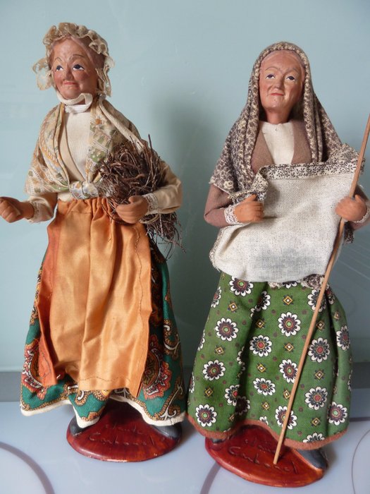 Two large santons signed Claude Carbonel