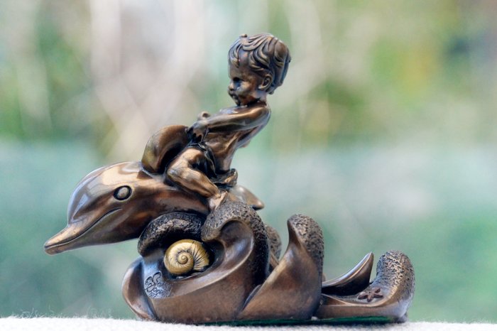 Giovanni Schoeman, bronze sculpture of a boy riding a dolphin