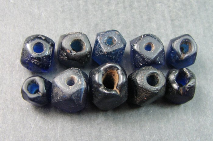 A string of 15 Roman blue glass beads / pendants - 20mm to 8mm in ...