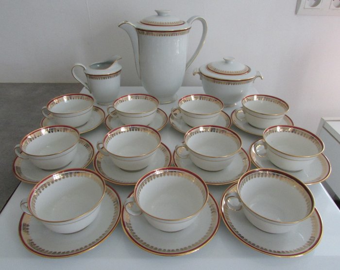 Bernardaud, Limoges porcelain coffee service, white with gold frieze and red border