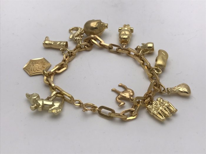 Bracelet with 11 different pendants, charm bracelet, yellow gold necklace 750/18k, approx. 21 cm