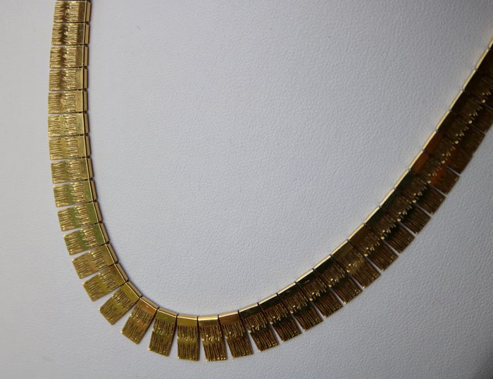 14kt.  Yellow gold "Cleopatra" handicraft collier, Choker shape with extending, rectangular chain links. 