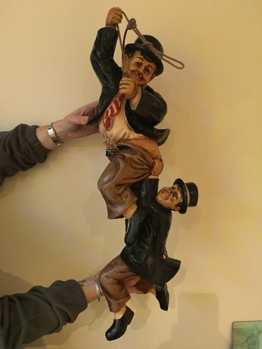 Laurel and Hardy figurines, hanging on rope