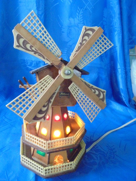 Old antique windmill with music box with rotating blades and light, made of wood, from Holland circa 1950