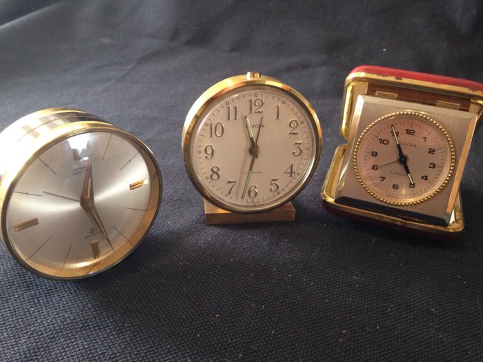 Three vintage watches of several types and ages, Amic Cyma Sonomatic - Europe 2 Jewels in bronze