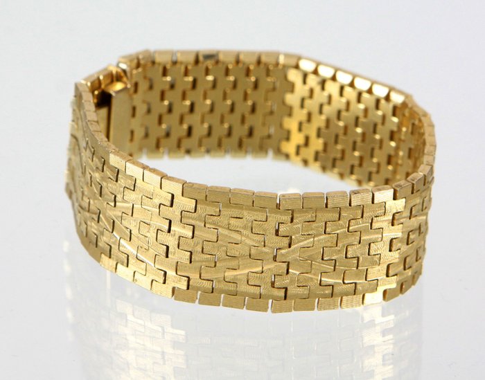 A wide bracelet for women, gold-plated