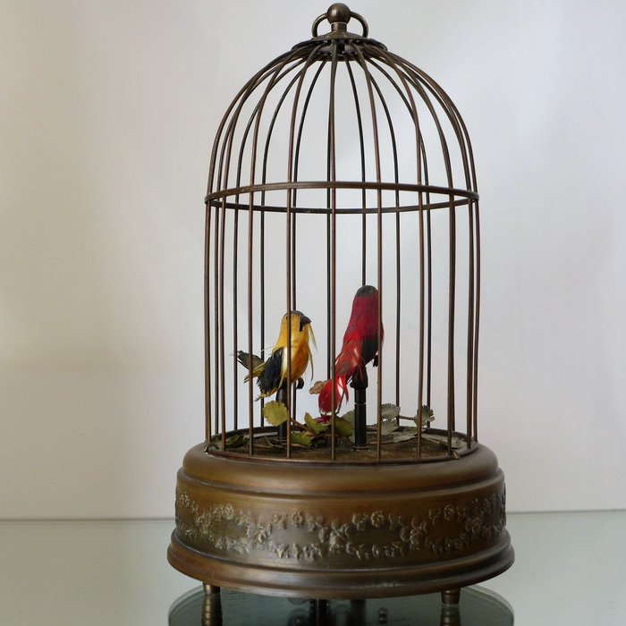 Reuge - old-fashioned mechanical music box in the shape of bird cage
