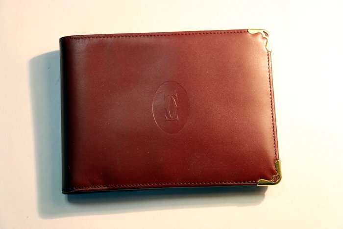 Cartier Paris. Wallet / brown leather 