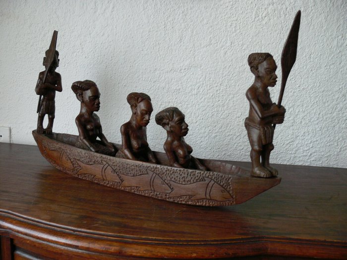 African wood carving, boat with Africans and rowers