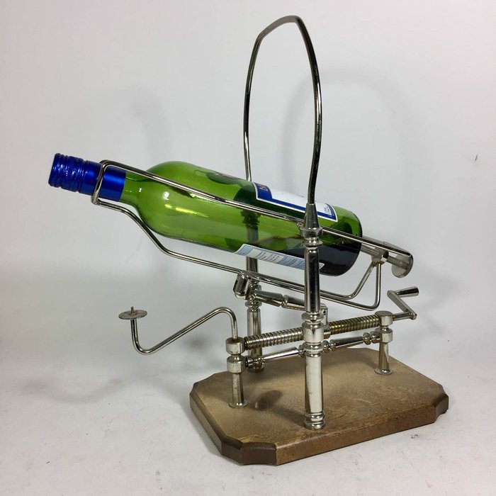 Unique vintage metal wine decanting cradle with candle holder, and handle to flip the bottle.