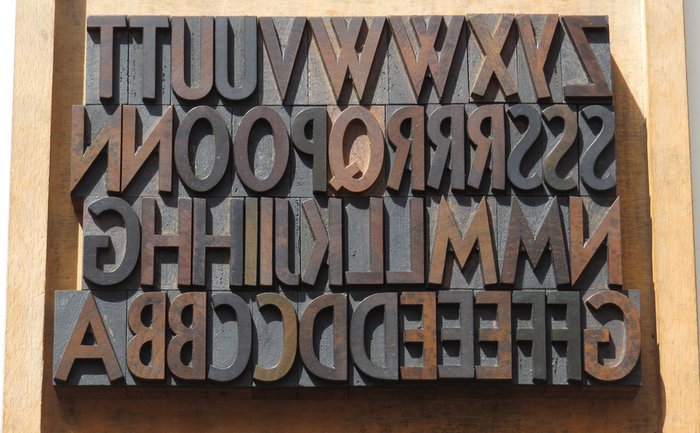 Set of antique wooden letters (printing letters, bill letters) complete with alphabet and many additional letters.