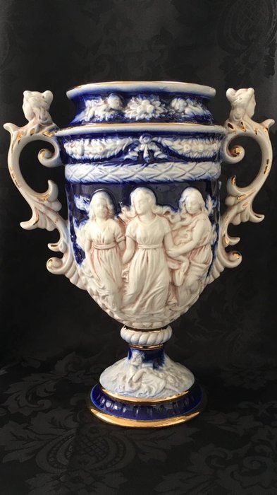 Italian cobalt blue cherub vase on a base with two handles, second half of 20th century