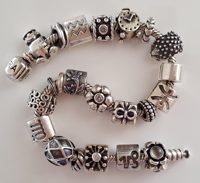 Pandora bracelet with 22 Pandora charms.