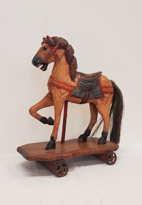 Antique wooden horse on wheels, hand 