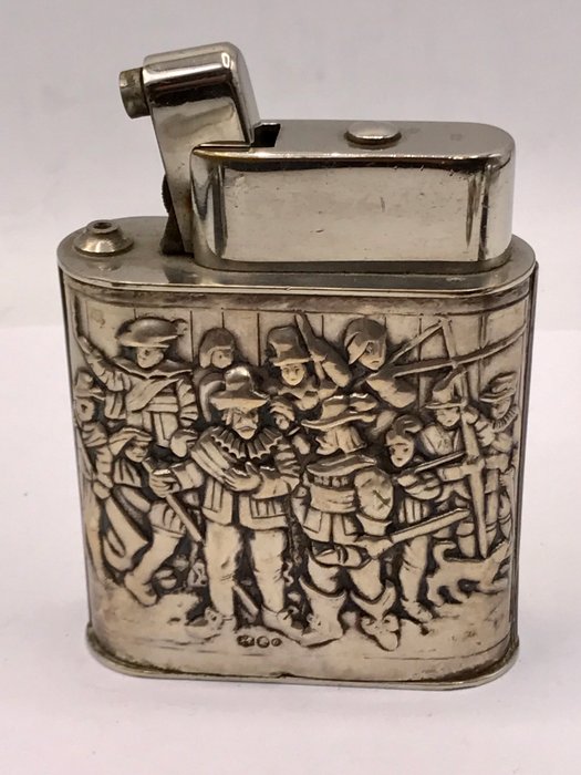 Antique large heavy table lighter in decorated Dutch silver holder.