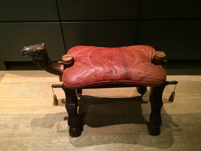Old vintage leather camel saddle (stool)