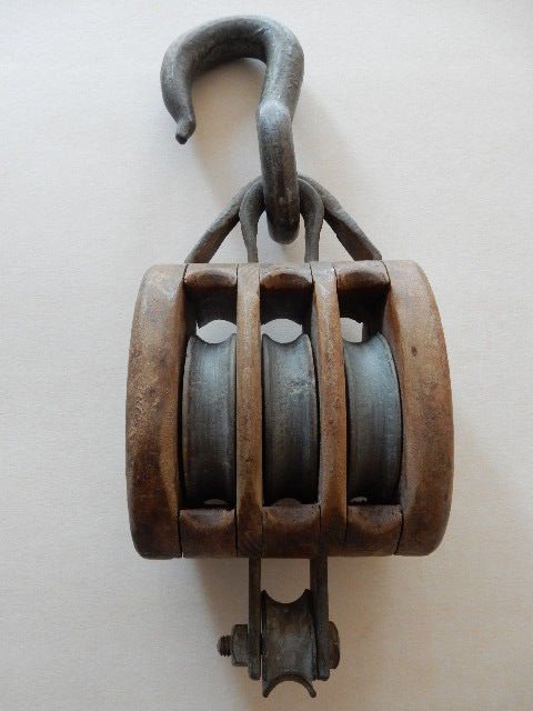 Old and large pulley hoist - triple sheaves of wooden boat - anvil decoration - early 20th century