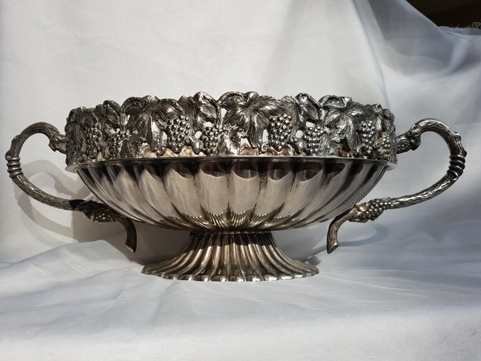 Antique silver plated large fruit bowl adorned around with grapevines