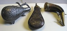 Set of three 19th century powder horns
