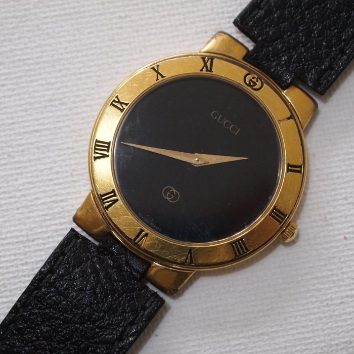 black and gold gucci watch