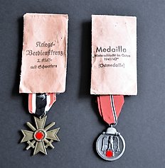 War Merit Cross 2nd class with swords and East Medal 1941/42 on a ribbon and with award bags