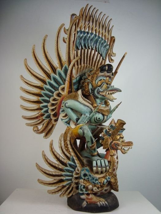 Large wooden statue of Garuda and the winged Naga – Bali – Indonesia