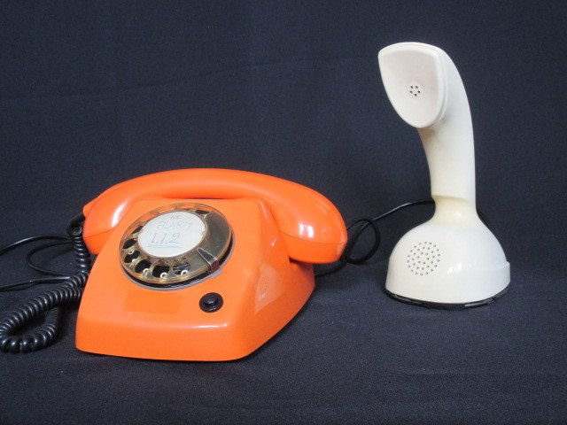Ericsson - two telephones: orange 'T65 deluxe' and ivory 'LM 600' (cobra)