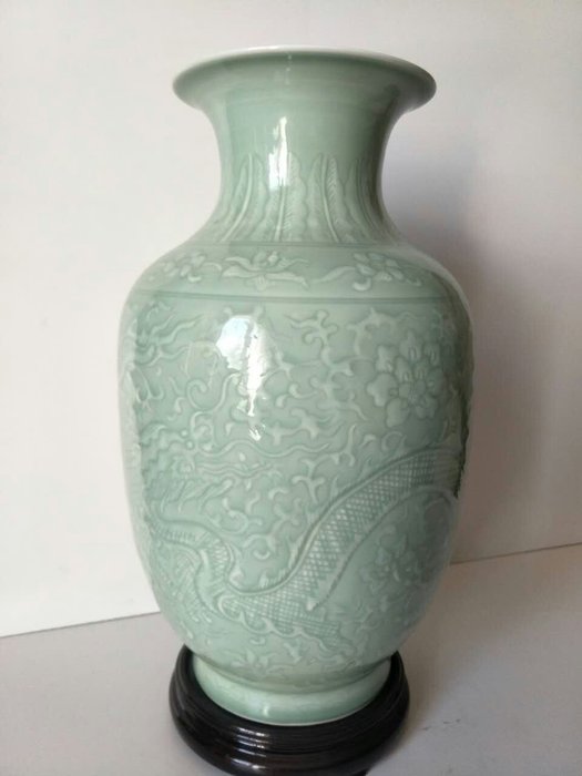Celadon porcelain vase with dragon and flowers decoration – China – late 20th century. 