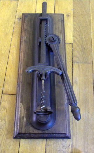 Wall corkscrew made of wood and cast iron. First half of the 20th century.