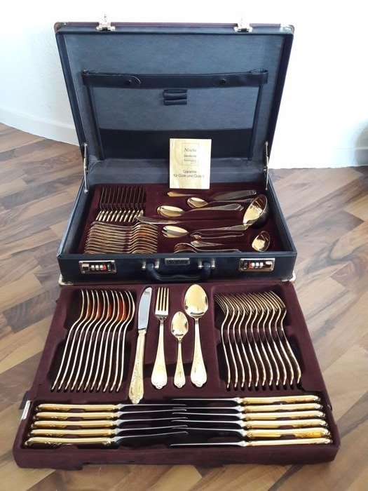 Nivella Solingen - 70 teiliges vergoldetes Luxus - Besteck für 12 Personen - 23/24 Karat - 1000er Feingold - unbenutzt - hartvergoldet - in schwarzem Originalkoffer 
