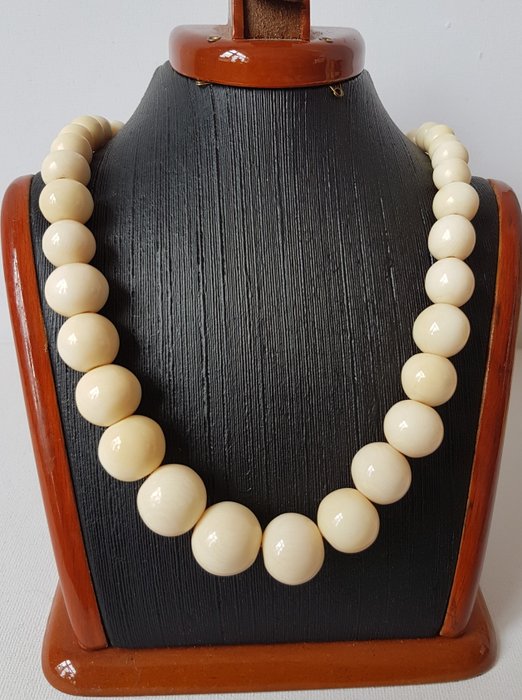 An antique, ivory beads necklace.